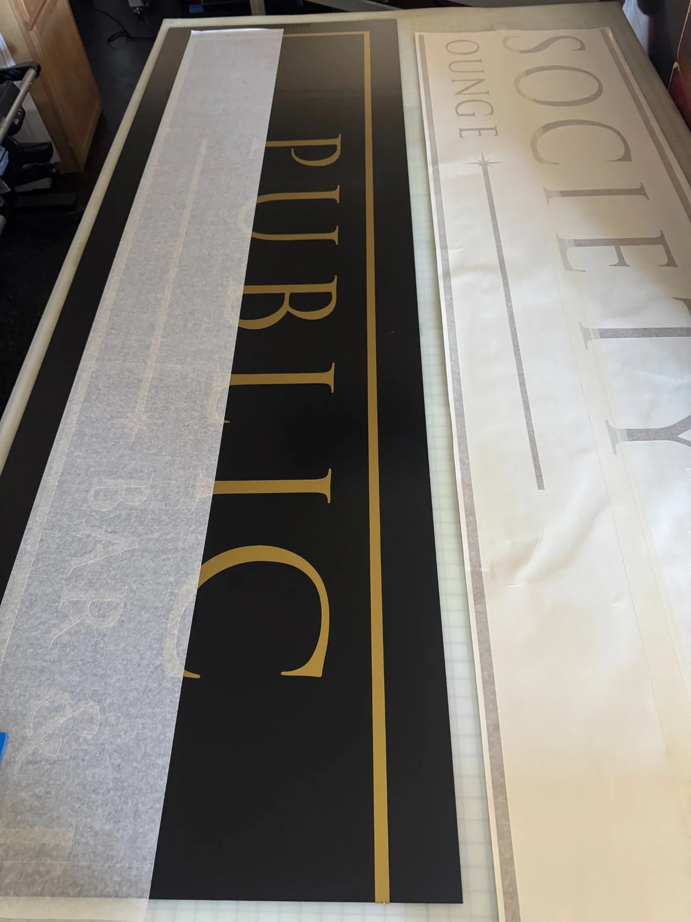 Custom sign being prepared in the shop