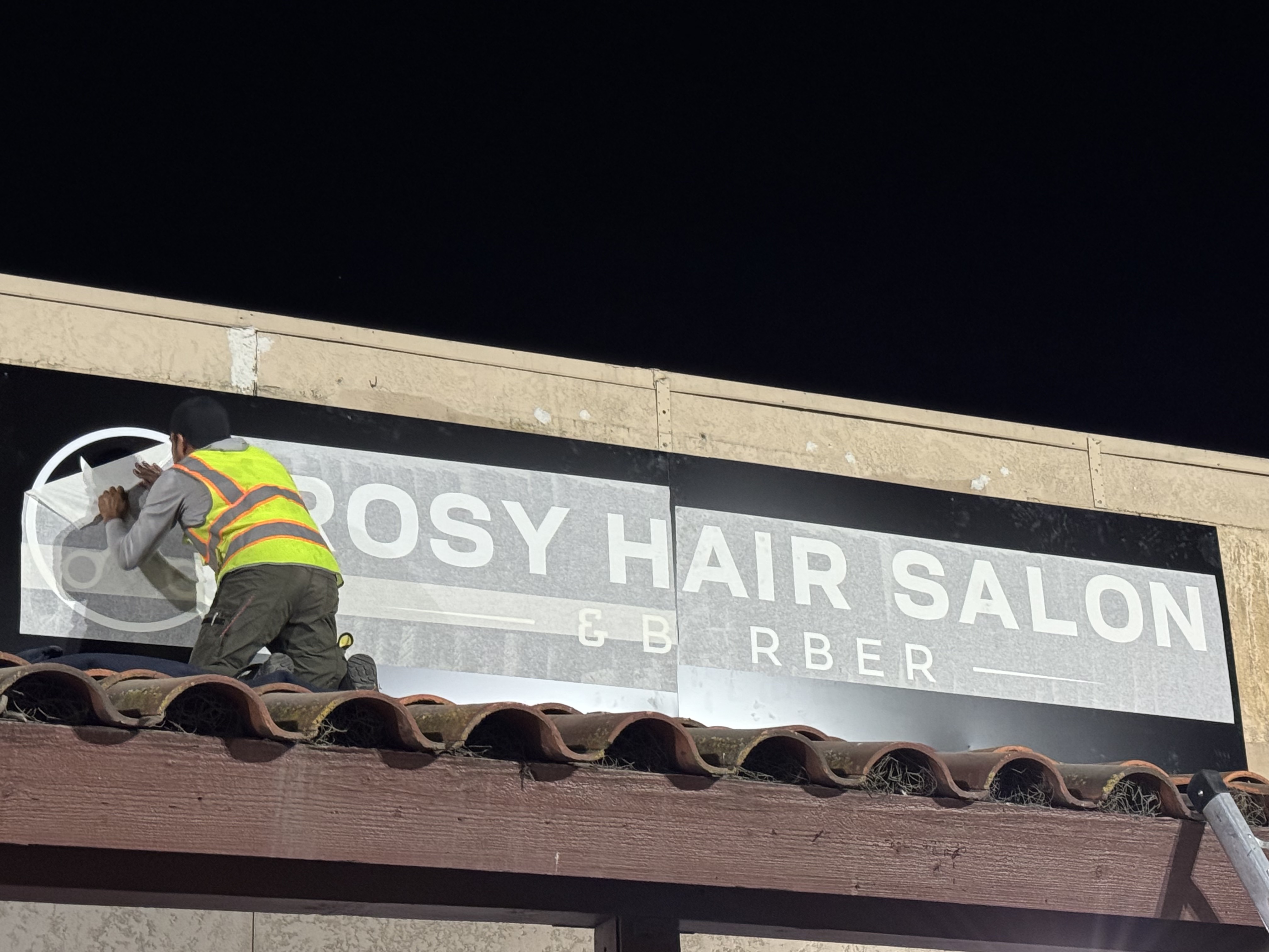 04 Installation of the new unified storefront sign — Rosy's Hair Salon & Barber — Modesto, CA